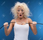 23306702-Funny-girl-having-problem-with-electricity-Electrical-shock-Stock-Photo.jpg