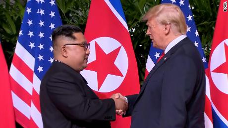 180611204213-02-trump-kim-handshake-0611-screengrab-large-169.jpg