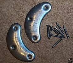 This may contain: two metal pieces with screws on them and the words who knows what these are?