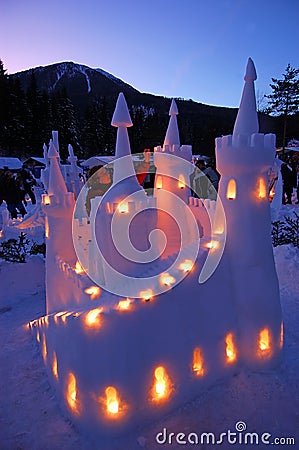 snow-castle-lit-candles-twilight-1332916.jpg