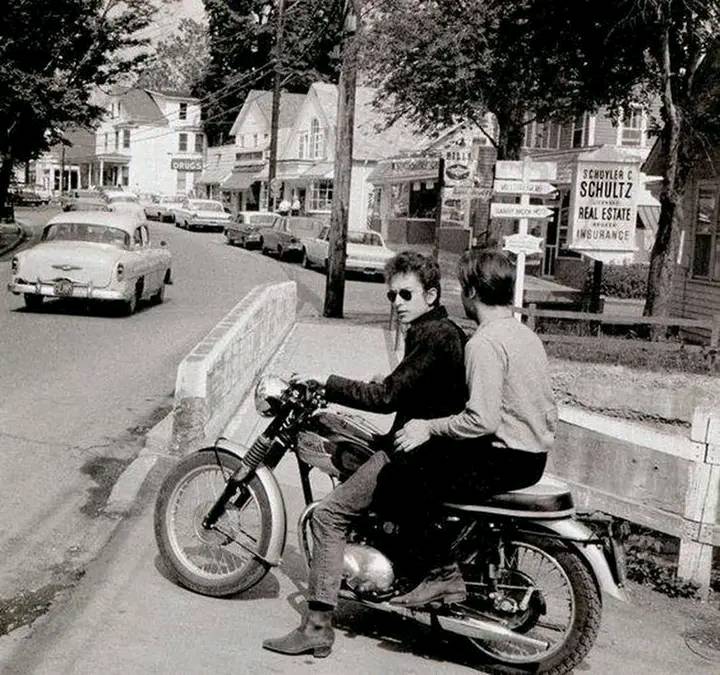 May be an image of 2 people and motorcycle