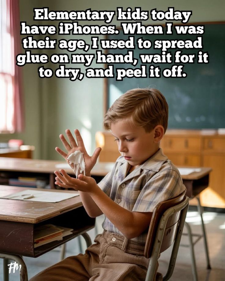 This may contain: a young boy sitting at a desk with his hands in front of him and the words elementary kids today have iphones when i was their age, i used to spread glue glue on my hand