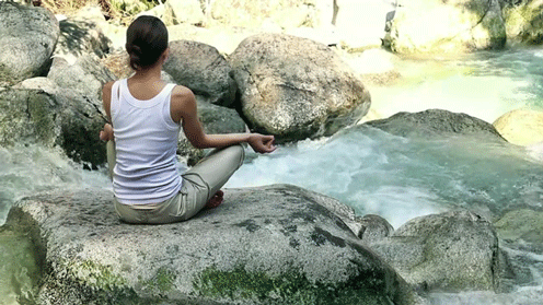meditating-on-rock-overlooking-flowing-river-gif.gif